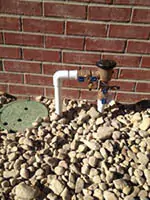 backflow on side of house