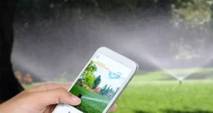 Smartphone controlling smart sprinkler system for automated lawn watering in a residential yard