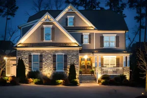 Custom architectural outdoor lighting illuminating a two-story home in Indianapolis at night