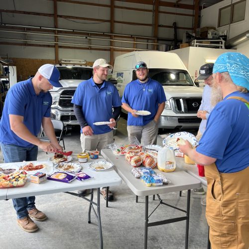 Warweg & Co., Inc. team eating and talking