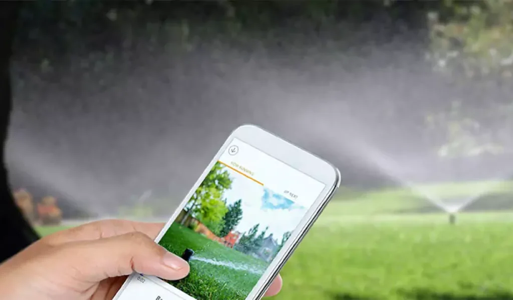 Smartphone controlling smart sprinkler system for automated lawn watering in a residential yard