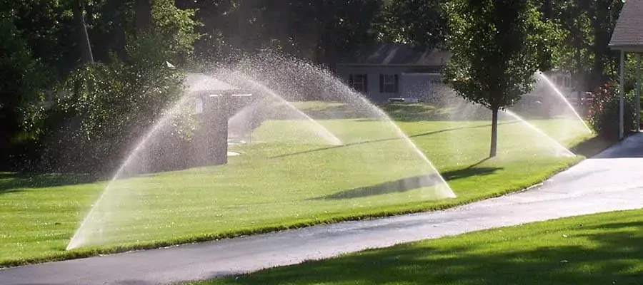 sprinklers spraying large grassy area