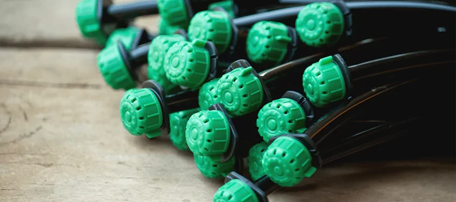 Drip irrigation lines with green caps